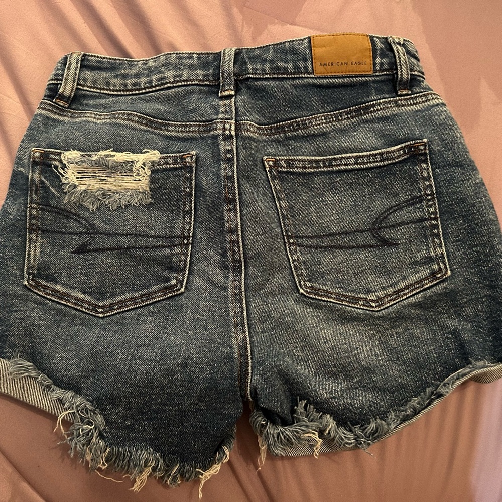 American Eagle Outfitters Mom Jeans asymmetrical button closure shorts. Size 0
